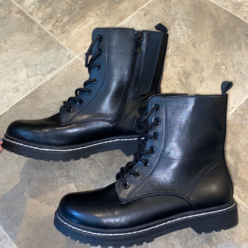 Womens Torid black leather boots.
